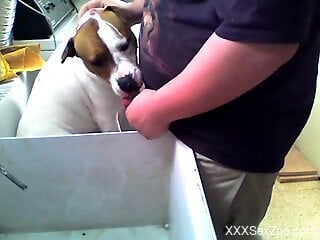 Horny man wants to push his whole dick in the dog's mouth